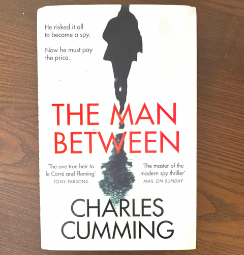 Harpercollins the man between - man,